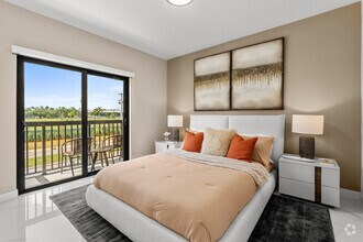 2BR, 2BA - 890SF - Primary Bedroom - Flamingo Village