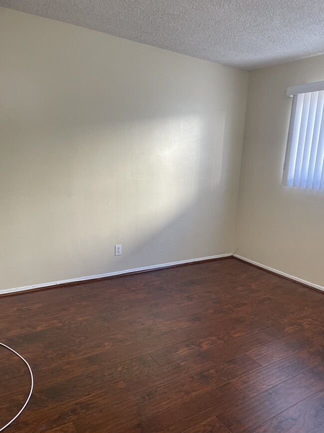 Bedroom with new laminate flooring - 237 E Navilla Plz