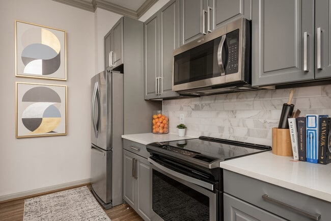 Gourmet Kitchen with Stainless Steel Appliances at The Hendry Apartments - The Hendry