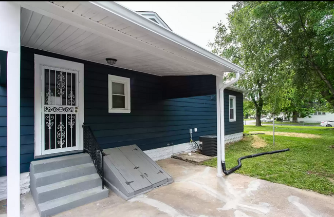 Covered side porch, patio and cellar door - 3100 Montana Ave