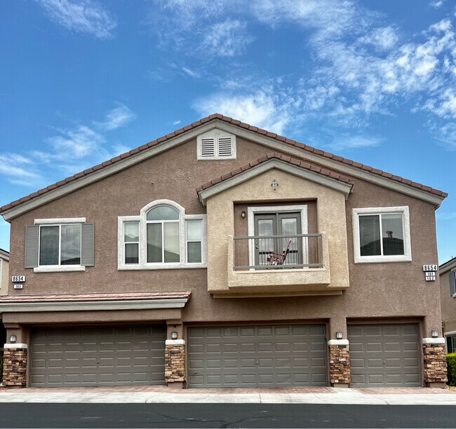 Corner unit with attached garage with entrance into condo - 8654 Travelling Breeze Ave