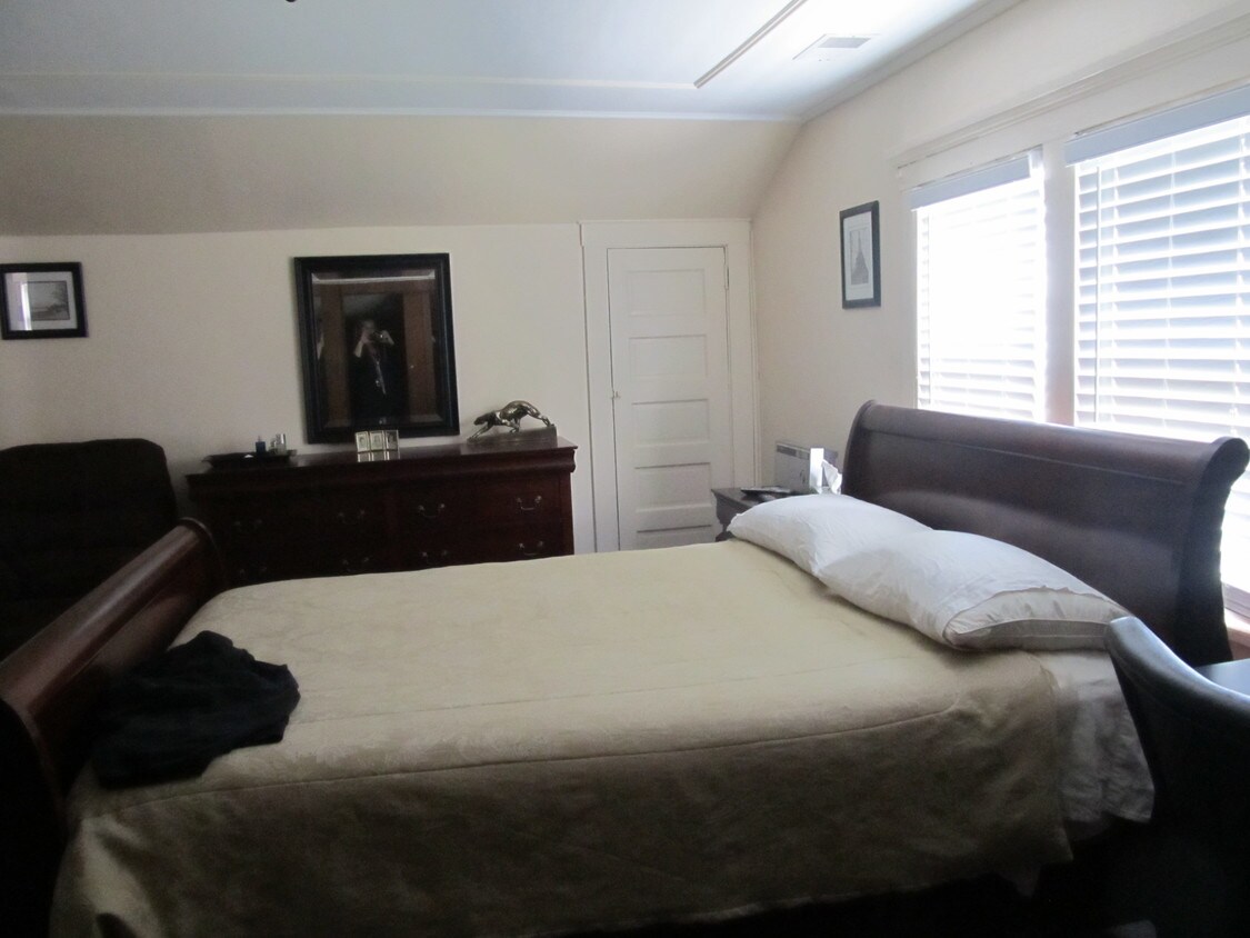 Bedroom ( this is a KING) Example of prior tenant furnishing - 2053 Woodbridge Ave