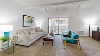 Located at 1942 Deerpark Dr in Fullerton, CA, this single-story, 3-bedroom, 2-bathroom home offers a well-designed layout across a compact yet efficient floor plan. The living room is a standout space, featuring striking vaulted ceilings with exposed wood beams, neutral carpet flooring, and a sliding glass door that opens to a private patio, flooding the room with natural light. A ceiling fan adds comfort, while the open flow into the dining area enhances the sense of spaciousness.

The dining area sits adjacent to the living room and features wood-style flooring, a ceiling fan, and a wainscoted accent wall, creating a warm, inviting atmosphere. The kitchen is bright and functional, boasting white shaker cabinetry, granite countertops, a peninsula with a breakfast bar, recessed lighting, and wood-style flooring throughout.

The bedrooms are carpeted and tranquil, including a well-proportioned primary bedroom. Two full bathrooms each feature tub/shower combinations, granite-topped vanities, and clean white finishes. A carpeted hallway connects the private bedroom wing to the main living areas, with two closets providing ample storage. This home combines classic mid-century character with practical, updated finishes.