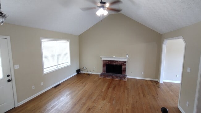Living room with fireplace and hardwood floors - 2765 Old Barn Trail
