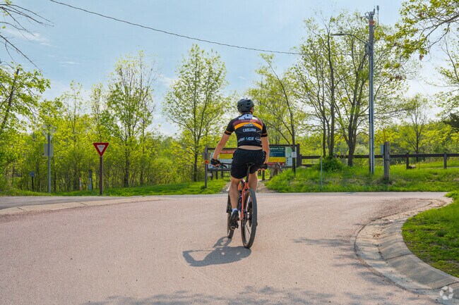 A mountain biker entering the trail at Murphy-Hanrehan Park.