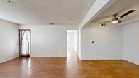 Located at 1657 Huntington Drive in Duarte, California, this single-floor, one-bedroom, one-bathroom unit offers a practical and well-organized layout across a compact but efficient footprint. Warm wood-look flooring runs consistently throughout the space, creating a cohesive and inviting atmosphere.

The open living and dining areas are bright and clean, featuring white walls, textured ceilings, and multiple windows that allow natural light to flow through. The living room connects seamlessly to the rest of the unit via a central hallway, providing an easy flow between spaces.

The kitchen is well-appointed with crisp white cabinetry, ample upper and lower storage, a stainless steel refrigerator, a stainless steel range with an overhead vent hood, and a double-basin sink — offering everything needed for everyday cooking.

The bedroom is a comfortable, well-lit room featuring a large window with blinds, a door with a curtain panel, and a ceiling fan with light fixture, adding both function and air circulation. A smart thermostat is also present in the unit.

The bathroom is clean and accessible, equipped with a toilet, vanity, and a glass-enclosed shower with marble-style walls and safety grab bars. The hallway provides additional utility access. Overall, the unit presents a clean, move-in-ready space ideal for comfortable single-occupant living.