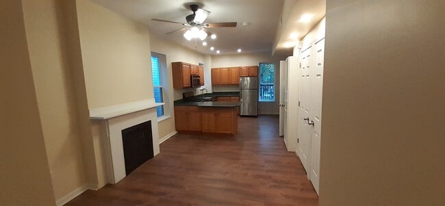 looking back at kitchen from door of front bedroom - 7718 Brashear St Apartments
