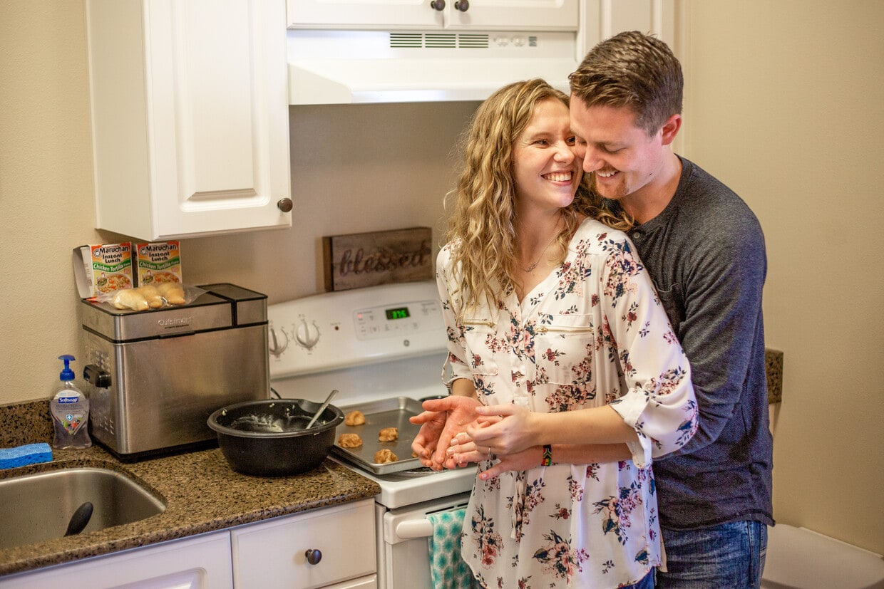 Tenants having fun cooking together in their open-concept kitchen - 332 S 4th W
