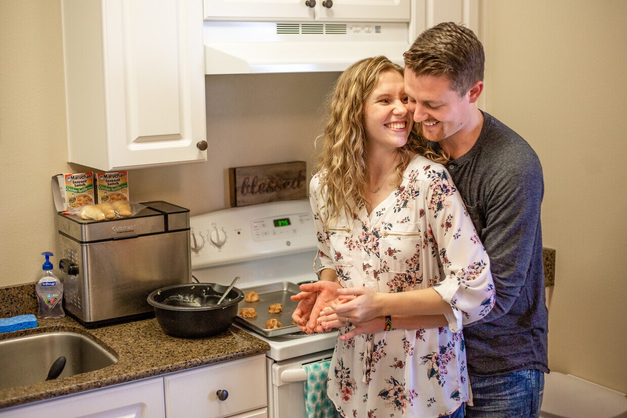 Tenants having fun cooking together in their open-concept kitchen - 332 S 4th W