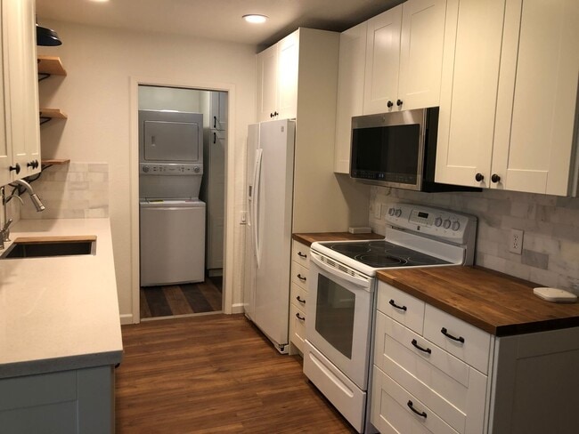 Building Photo - Check out this perfect updated gem, long t...