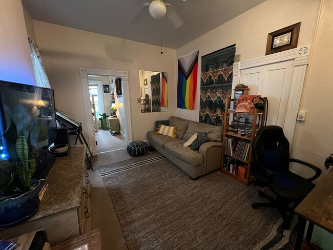 View from living room into bed room, with closet and shelf space on the right.. - 1321 Hunter Ave