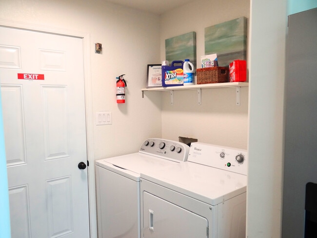 Convenience of washer and dryer inside the home. - 8941 E 24th Ln