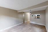 Located at 330 Ingleside Dr in Baton Rouge, Louisiana, this single-story, 3-bedroom, 2-bathroom home offers a practical and well-appointed layout with clean, modern finishes throughout. Light-toned wood-look flooring runs through the main living areas, complemented by neutral warm-beige walls and crisp white trim, creating a cohesive and inviting atmosphere.

The living room is a comfortable open space featuring a pendant light fixture and a pass-through window that connects directly to the kitchen, enhancing the sense of openness. The kitchen is well-equipped with white shaker-style cabinets, black hardware, granite-look countertops, a stainless steel double-basin sink, and black appliances including a range and dishwasher.

The hallways are bright and efficiently laid out, with one leading to French doors that bring in natural light. The primary bedroom benefits from dual closets with built-in shelving and hanging rods, offering ample storage. Additional bedrooms include ceiling fans with light fixtures and windows with blinds for natural light and privacy. Both bathrooms feature tub-shower combinations with clean white surrounds. Textured ceilings are present throughout, adding a classic touch to this move-in-ready Baton Rouge home.