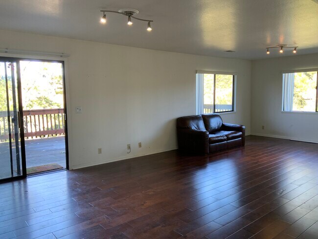 Living room with couch included - 1233 Lerida Way