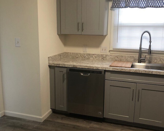Kitchen with new cabinets, appliances and vinyl plank flooring - 145 Bard Dr