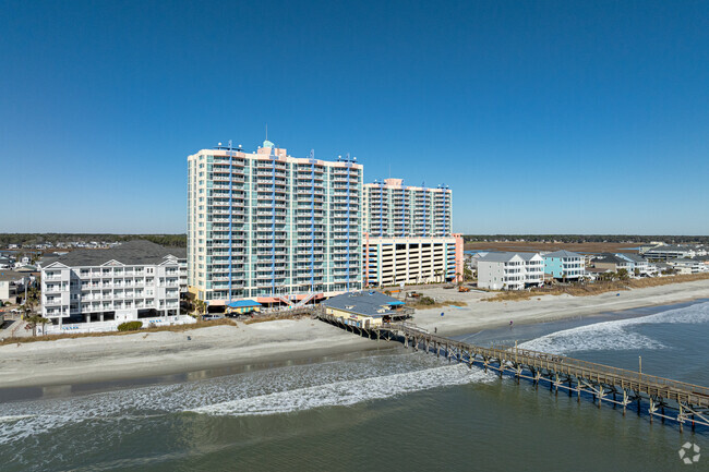 View from beach with fishing pier. - Prince Resort