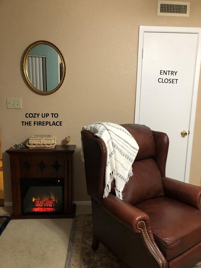 Prop you feet up & enjoy the faux fireplace. - 3515 Sable Palm Ln