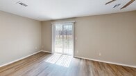 This 510 square foot apartment in Wichita, Kansas offers a compact yet comfortable living space. The single-story layout comprises one bedroom, one bathroom, and a living room, creating an efficient use of space. The property features modern finishes throughout, with a harmonious blend of materials including wood-look flooring in the main living areas and plush carpeting in the bedroom.

The living room is brightened by a large sliding glass door, which not only floods the space with natural light but also provides access to an outdoor area, extending the living space. A ceiling fan with an integrated light fixture adds both functionality and style to the room.

The bedroom, measuring 120 square feet, offers ample space for rest and relaxation. It's equipped with a closet featuring bi-fold doors and a window that allows for natural light and ventilation. The bathroom, while compact, includes essential fixtures such as a bathtub with shower functionality.

Throughout the apartment, neutral-toned walls create a blank canvas for personalization, while also contributing to a sense of spaciousness. The property's design prioritizes functionality and comfort, making it an ideal choice for individuals or couples seeking a low-maintenance living space in Wichita.