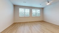 Located at 11305 Grant Rd in Houston, TX, this thoughtfully designed one-bedroom, one-bathroom unit offers a clean, modern aesthetic throughout its single-floor layout. Light-toned hardwood flooring runs continuously across every room, creating a bright and cohesive feel.

The combined kitchen and living area serves as the heart of the unit. The kitchen is outfitted with crisp white shaker cabinetry, a subway tile backsplash, stainless steel appliances including a French door refrigerator, range, and microwave, and a granite-topped island with an undermount sink — ideal for both cooking and casual dining.

The living area benefits from multiple windows fitted with blinds, allowing ample natural light while maintaining privacy. Ceiling fans are present in the living and bedroom spaces, adding both function and comfort.

The bedroom is a well-proportioned retreat featuring a large window with exterior views and a dedicated walk-in closet equipped with wire shelving and hanging rods for generous storage.

The bathroom is finished with marble-look tile surround in the tub/shower combination, a white vanity with granite countertop, and warm recessed lighting that contributes to a clean, spa-like atmosphere.

Throughout, the unit maintains a neutral color palette with white trim and doors, giving it a fresh and move-in-ready character.