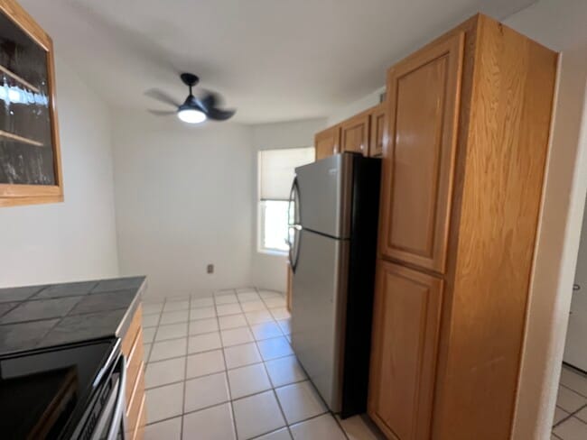 Kitchen w/ stainless steel appliances - 5675 N Camino Esplendora