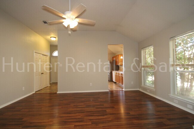 Building Photo - Exceptional Living with Vaulted Ceilings, Cozy Fireplace & Expansive Outdoor Space