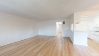 Located at 217 N Sunset Ave in West Covina, California, this two-bedroom, one-bathroom single-floor residence offers a clean, bright, and well-organized layout. Light wood laminate flooring runs consistently throughout the unit, complemented by crisp white walls and textured ceilings that lend the space a fresh, move-in-ready feel.

The open living and dining area is generously proportioned, providing a comfortable space for both relaxing and entertaining. Natural light filters in through window blinds, enhancing the airy ambiance. A wall-unit air conditioner ensures year-round comfort, and a balcony offers a pleasant outdoor extension to the living space.

The galley-style kitchen is efficiently designed with white cabinetry, granite-look countertops, a gas range, stainless steel dishwasher, and a double-basin sink — providing ample functionality in a compact footprint.

Both bedrooms are well-sized, bright, and feature sliding-door closets for convenient storage. The spacious primary bedroom offers additional room to accommodate a full furniture arrangement. A hallway connects the bedrooms to the full bathroom, which includes a single-sink vanity with white cabinetry, a tiled shower-tub combo, and matching light wood flooring. With three closets distributed across the unit, storage is plentiful throughout this practical and comfortable West Covina residence.