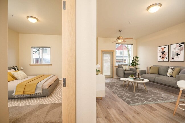 Fairview Village | Split View of Living Area and Bedroom - Fairview Village Apartments