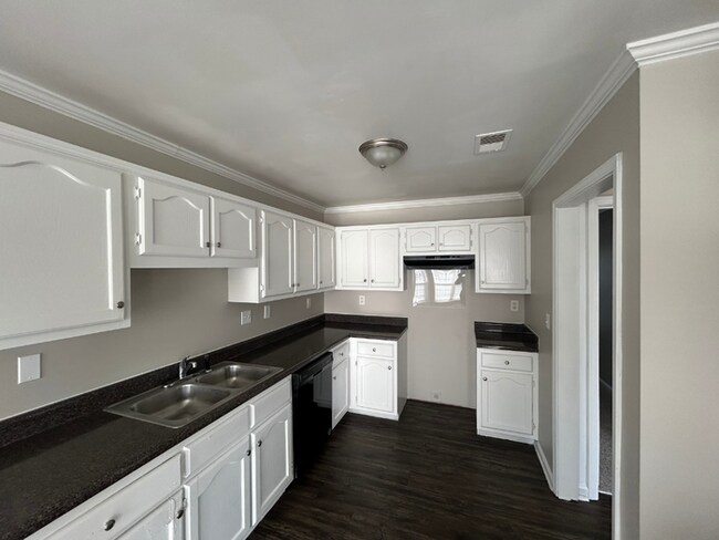 Building Photo - Spacious 4BR/2BA Olive Branch Home | 1,965 Sq Ft, Modern Fireplace, Bay Window & 2-Car Garage
