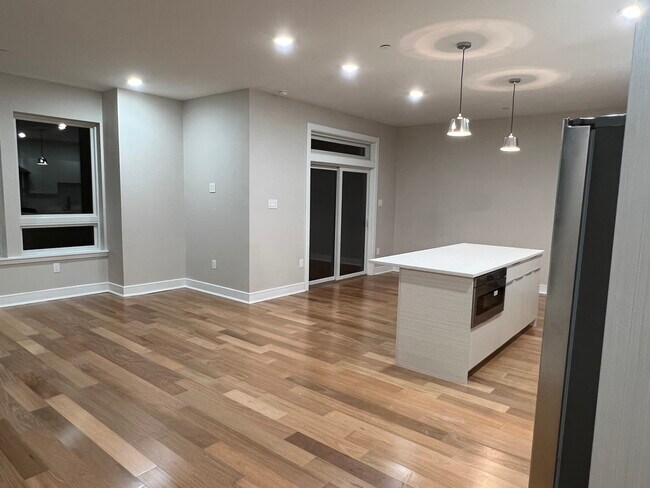 Kitchen space has a spacious eat in island with built in drawer microwave. Access to first balcony. - 3202 Capri Dr
