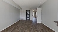 This 730 square foot townhouse in Louisville, Kentucky offers a compact yet functional living space across two floors. The ground floor, measuring 370 square feet, features a living room with wood-look flooring and large windows that allow natural light to flood the space. An in-unit washer and dryer are conveniently tucked away in a closet, enhancing the home's practicality.

The upper level, spanning 360 square feet, houses two bedrooms and a bathroom. The primary bedroom is generously sized at 140 square feet, with plush carpeting and a sizable closet. The second bedroom, while smaller, also includes carpet flooring and a closet. Both rooms benefit from windows that provide natural light and ventilation.

The bathroom showcases modern fixtures, including a vanity with a granite countertop and undermount sink. A framed mirror and ample storage in the vanity add both style and functionality to the space.

Throughout the home, neutral-toned walls create a blank canvas for personalization. The staircase connecting the two floors adds to the home's vertical interest, while a hallway on the upper level ensures easy navigation between rooms. This townhouse efficiently utilizes its 730 square feet to provide a comfortable living environment in a desirable Louisville location.