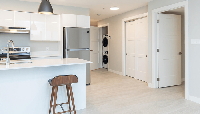 Crown Isle Boulevard Kitchen & Living Space WIth Insuite Laundry - Crown Isle Boulevard