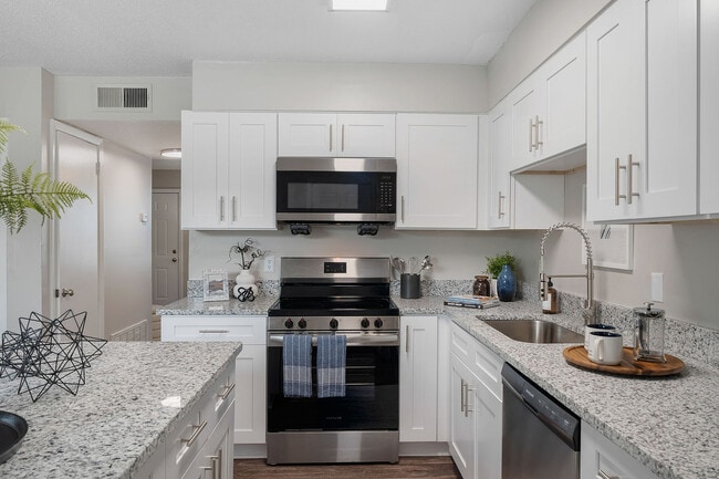 Kitchen with granite counters, stainless appliances, and modern cabinetry - Blakely