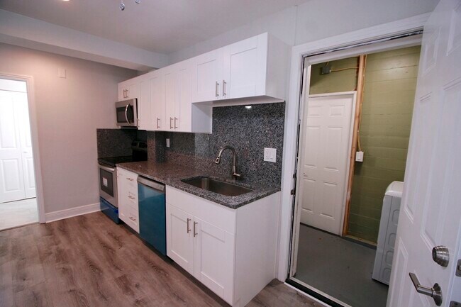 Kitchen side view with view of attached/shared laundry room - 5001 1/2 1st ave N