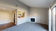 Located at 13100 Stonefield Dr in Houston, TX, this two-story home offers three bedrooms, one bathroom, and a thoughtfully arranged layout spread across two floors. The main level is the larger of the two and hosts the primary living spaces, including a generous living room distinguished by soaring vaulted ceilings and a classic white-surround fireplace — a central focal point of the home. Plush carpet covers the living area, while wood-look flooring transitions into the kitchen and dining areas. The kitchen features a convenient pass-through window that opens to the living and dining space, white cabinetry, a natural light-admitting window, and room for standard appliances. The dining room sits adjacent, creating an open, connected flow on the main floor. A patio provides outdoor access directly from the main level. The bathroom is equipped with a full tub-shower combo, tile surround, and light wood-look flooring. The three carpeted bedrooms are distributed across both floors, each offering neutral walls and windows that invite natural light. The primary bedroom is a comfortable size with good proportions. Two closets serve the home's storage needs, and a staircase connects the two levels seamlessly throughout.