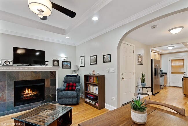 Warm fireplace with a beautiful arched entrance. - 6969 N Wolcott Ave