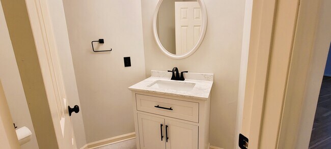 Guest bathroom at entrance doorway - 111 Greenmeadow Ln