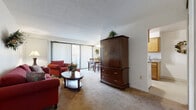 Located at 30707 Lake Shore Blvd in Willowick, Ohio, this single-floor residence offers a well-organized and comfortable layout throughout its living spaces. The living room serves as the heart of the home, featuring plush carpeting, a large sliding glass door with vertical blinds that fills the room with natural light, and an open connection to both the dining area and kitchen. The space is warm and inviting, with ample room for seating and storage.

Adjacent to the living room, the dining area accommodates a full-sized table and chairs beneath a ceiling fan with a light fixture, with a sliding glass door providing additional natural light and outdoor access. The galley-style kitchen is efficiently designed with warm wood cabinetry, granite-look countertops, a gas range, refrigerator, and a double sink — all conveniently open to the dining area.

The bedroom is a tranquil retreat with soft carpeting, generous natural light from a large window with vertical blinds, and access to a spacious walk-in closet outfitted with wire shelving and hanging rods for ample storage. The full bathroom features a wood vanity with a wide mirror cabinet, tile flooring, and a shower-tub combination.