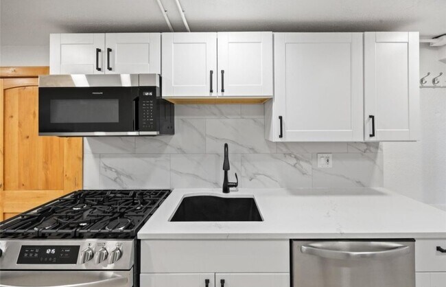 Brand new kitchen with quartz countertops and gas range/oven - 5014 W 36th Ave