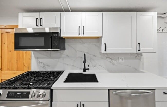 Brand new kitchen with quartz countertops and gas range/oven - 5014 W 36th Ave