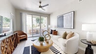 Located at 1891 N Litchfield Rd in Goodyear, Arizona, this single-floor residence offers a thoughtfully designed layout that maximizes comfort and functionality. The open-concept living and dining area is bright and airy, featuring light wood-style flooring, neutral tones, and a ceiling fan. Sliding glass doors lead to a private patio, flooding the space with natural light and offering pleasant outdoor views — a standout feature of the living area.

The kitchen is outfitted with crisp white shaker cabinetry, stainless steel appliances including a full-size refrigerator, electric range, and built-in microwave, complemented by light countertops and a classic subway tile backsplash. Light flooring carries throughout, maintaining a cohesive, modern aesthetic.

The spacious bedroom provides a comfortable retreat, featuring multiple windows with natural light, a ceiling fan, and soft neutral wall tones. The well-proportioned room easily accommodates a large bed and additional furnishings.

The bathroom is finished in a clean, contemporary style with light wood-tone floating vanity, a full tub-shower combination with white tile surround, and light flooring that ties the space together. A hallway connects the rooms efficiently, completing this well-organized and stylish single-level home.