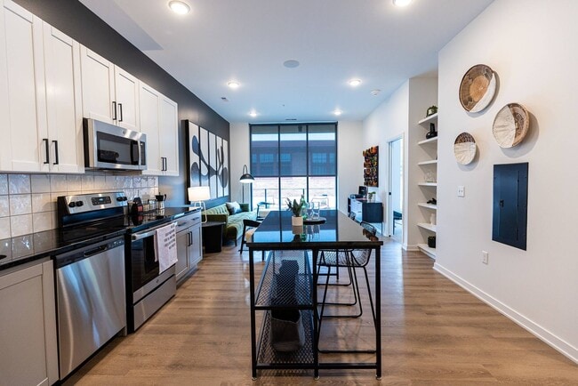 Featuring an adjustable island in the kitchen - HELLO