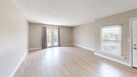Located at 724 Teasel Dr in Kingsport, Tennessee, this single-floor, 2-bedroom, 1-bathroom home offers a clean, functional layout with a cohesive neutral design throughout. Light wood-style flooring flows consistently across every room, complementing the warm beige and greige wall tones that create a bright, welcoming atmosphere.

The spacious living room is a standout feature, anchored by a set of French doors that open to an outdoor deck and allow abundant natural light to fill the space. An additional window further enhances brightness. The kitchen is equipped with white cabinetry, a coil-burner electric range with overhead ventilation, and grey countertops, offering ample storage and a practical workspace.

Both bedrooms are comfortably sized, with the primary bedroom featuring a dedicated closet. Each bedroom includes windows with outdoor views, textured ceilings, and light-filled interiors. The full bathroom is fitted with a shower-tub combo, tile surround, and brushed nickel fixtures.

A hallway connects the main living areas to the bedrooms and bathroom, while a dedicated closet provides additional storage. The home's consistent finishes, clean lines, and well-distributed natural light make it a practical and comfortable residence in Kingsport, TN.