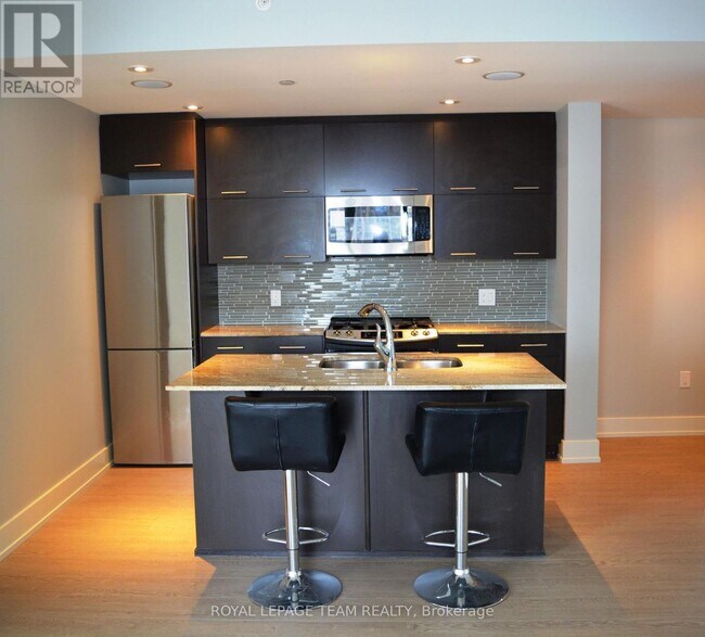 Building Photo - 100 Champagne Ave S