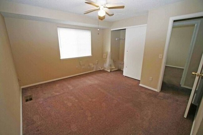 Building Photo - Deer Run attached home with yard, 2-car ga...