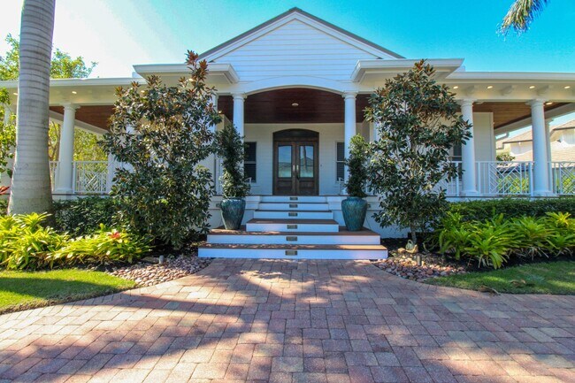 Foto del edificio - **STUNNING POOL HOME**4BEDS / 4.5BATHS**AQUALANE SHORES**FURNISHED SEASONAL RENTAL**6-SEAT GOLF C...