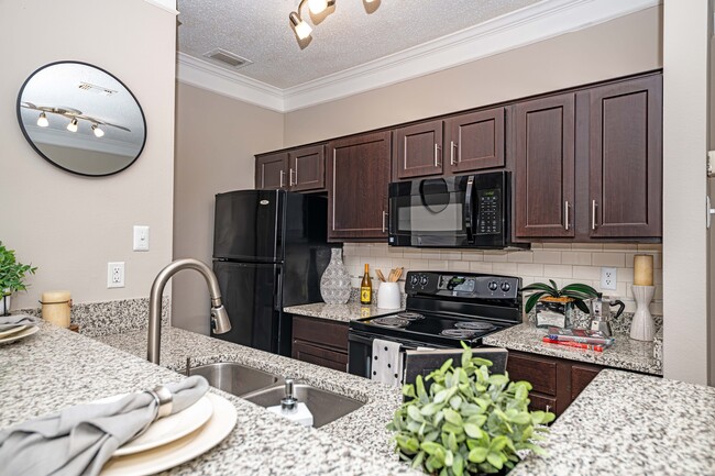 Kitchen with modern cabinetry - The Indigo at Grissom