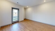 Located at 950 Professional Parkway in Marysville, Ohio, this well-designed one-bedroom, one-bathroom unit offers a clean, modern aesthetic across a single thoughtfully laid-out floor. The open-concept kitchen and living area serves as the heart of the space, featuring warm wood-look luxury vinyl flooring, crisp white walls, and recessed lighting. The kitchen is outfitted with white shaker-style cabinetry extending to the ceiling for ample storage, granite countertops, a stainless steel sink, and a full suite of stainless steel appliances including a refrigerator, electric range, and built-in microwave. A peninsula with pendant lighting above provides additional workspace and casual dining potential. The living area benefits from a private entry door with a glass panel that welcomes natural light and outdoor views. The bedroom is a comfortable retreat finished with plush carpeting, a bright window with blinds, and clean neutral walls. The bathroom continues the modern finishes with warm wood-look flooring, a granite-topped vanity with white cabinetry, and a spacious walk-in shower stall with built-in shelving and a glass door. Throughout, the unit maintains a cohesive, contemporary design with light tones and quality materials.