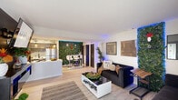 Located at 4254 Maple Leaf Dr in New Orleans, LA, this single-floor, 1-bedroom, 2-bathroom home delivers a striking blend of contemporary design and eclectic personality. The open-concept living and kitchen area serves as the heart of the home, anchored by a dramatic floor-to-ceiling living green wall illuminated by vibrant LED accent lighting. Light wood flooring runs throughout, complementing the bright, neutral walls and creating a cohesive flow between spaces. The kitchen features gray cabinetry, a subway tile backsplash, stainless steel appliances, and a peninsula that seamlessly connects to the living and dining area. The living room offers generous seating, curated wall art, and access to the outdoors via a sliding glass door. A dedicated office space provides natural light through multiple windows and a tranquil setting for productivity. The primary bedroom is a richly styled retreat, complete with teal drapery, a gallery wall, macramé accents, and a built-in electric fireplace headboard. Both bathrooms are clean and well-appointed, featuring dark-framed fixtures, white countertops, and thoughtful decorative touches. Two closets and an entrance area round out the efficiently organized layout of this uniquely curated New Orleans home.