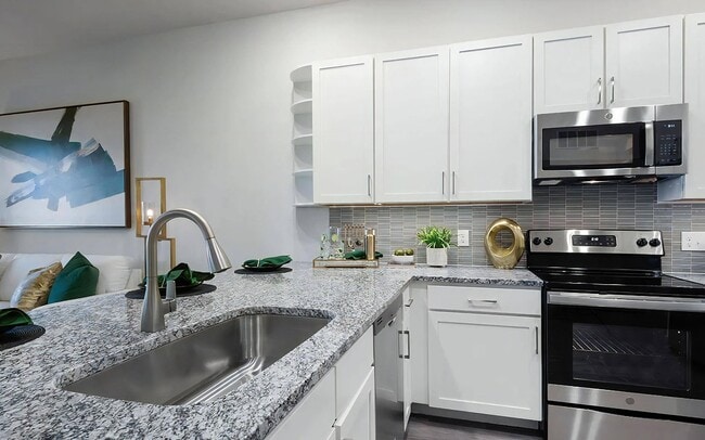 Kitchen with Granite Countertops, Stainless Steel Appliances, and Stylish Backsplash - The Harper