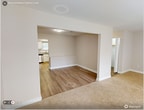 Located at 5109 Goldsboro Dr, Unit 33A in Hampton, VA, this two-story apartment offers 1,280 square feet of living space across three bedrooms and three bathrooms. The first floor (630 sq ft) features a well-appointed kitchen with white shaker cabinets, granite countertops, a subway tile backsplash, and stainless steel appliances including a gas range, microwave, and dishwasher. A stacked washer and dryer unit is conveniently located adjacent to the kitchen. The first floor also includes a hallway, a full bathroom with a tub/shower combo, white vanity, and hardwood-style flooring. An open living and dining area transitions between hardwood-style and carpet flooring, offering a versatile layout. The second floor (650 sq ft) houses three carpeted bedrooms, including a primary bedroom measuring 210 square feet. Additional bathrooms include a clean, minimalist design with white vanities and brass fixtures. Neutral tones throughout the home, white panel doors, and consistent trim work give the unit a cohesive, move-in-ready aesthetic. The bedrooms feature windows with blinds, providing natural light and privacy.